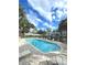 Inviting community pool with lounge chairs and manicured landscaping at 2550 Alafaya Trl # 9303, Orlando, FL 32826