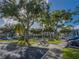 Community pool and picnic tables nestled among mature trees at 2550 Alafaya Trl # 9303, Orlando, FL 32826
