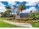 Beautiful community sign for Horse Creek at Crosswinds with colorful flower beds at 2596 Penguin Blvd, Davenport, FL 33837