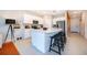Modern kitchen with a large island, stainless steel appliances, and pendant lighting at 2596 Penguin Blvd, Davenport, FL 33837