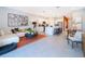 Open-concept living room and kitchen with modern appliances and stylish decor, perfect for entertaining at 2596 Penguin Blvd, Davenport, FL 33837