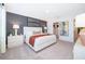 Main bedroom features a soft rug, accent wall, and decor that adds a touch of elegance at 2596 Penguin Blvd, Davenport, FL 33837