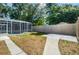 This backyard includes an enclosed pool area, patio, and privacy fence at 2905 Elbert Way, Kissimmee, FL 34758