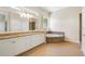 Bright primary bathroom with double sinks, granite countertop, jetted tub, and tiled floors at 2905 Elbert Way, Kissimmee, FL 34758
