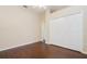 Bedroom with hardwood floors, closet, and neutral paint, offering a serene and comfortable atmosphere at 2905 Elbert Way, Kissimmee, FL 34758