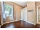 Bedroom with hardwood floors, window, and closet space, offering a bright and comfortable living space at 2905 Elbert Way, Kissimmee, FL 34758