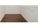 Walk-in closet with hardwood floors, white trim, and a wire shelf for storage and organization at 2905 Elbert Way, Kissimmee, FL 34758