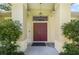 Grand double door entrance with elegant columns and a hanging lantern, creating a welcoming first impression at 2905 Elbert Way, Kissimmee, FL 34758