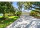 Charming single-story home with a well-manicured lawn, mature trees, and a two-car garage, perfect for suburban living at 2905 Elbert Way, Kissimmee, FL 34758