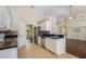 Open kitchen with granite countertops, stainless steel appliances, and seamless flow to the living area at 2905 Elbert Way, Kissimmee, FL 34758