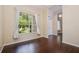 Spacious living room featuring large windows, hardwood floors, and seamless access to the entryway at 2905 Elbert Way, Kissimmee, FL 34758