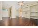 Spacious living room featuring hardwood floors, vaulted ceilings, and custom built-ins, ideal for entertaining at 2905 Elbert Way, Kissimmee, FL 34758