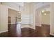 Bright, open-concept living area with hardwood floors, a wall of shelves, and access to the pool area at 2905 Elbert Way, Kissimmee, FL 34758