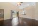 Open concept living room with sliding glass doors and a glimpse of the kitchen, perfect for modern living at 2905 Elbert Way, Kissimmee, FL 34758