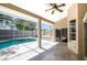 Enjoy the outdoors in this screened-in lanai with a pool and a ceiling fan for warm days at 2905 Elbert Way, Kissimmee, FL 34758