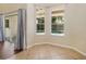 Sunroom with tile flooring and windows offering a view of the sparkling pool and outdoor area at 2905 Elbert Way, Kissimmee, FL 34758