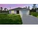 Charming single-story home with a well-manicured lawn and a spacious two-car garage at 2925 Sw 172Nd Lane Rd, Ocala, FL 34473