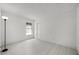 A bright bedroom with light wood flooring featuring a window and double door closet at 2978 Stillwater Dr, Kissimmee, FL 34743