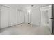 Bright bedroom featuring light wood flooring and a double door closet at 2978 Stillwater Dr, Kissimmee, FL 34743