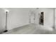 Bright bedroom with light wood flooring, showing doors to the hallway and bathroom at 2978 Stillwater Dr, Kissimmee, FL 34743