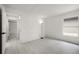Bright bedroom with light wood flooring featuring a window and a door to another room at 2978 Stillwater Dr, Kissimmee, FL 34743