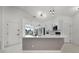 Modern kitchen featuring white cabinets, stainless steel appliances, and a large island at 2978 Stillwater Dr, Kissimmee, FL 34743