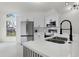 Updated kitchen featuring white cabinets, stainless steel appliances, and modern fixtures at 2978 Stillwater Dr, Kissimmee, FL 34743