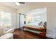 Bright bedroom features a modern ceiling fan, light walls, and dark wood floors at 3 W Yale St, Orlando, FL 32804