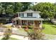 Charming two-story home with a welcoming front porch, brick accents, and a lovely landscaped yard at 3 W Yale St, Orlando, FL 32804