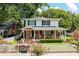 Charming two-story home with a welcoming front porch, brick accents, and a lovely landscaped yard at 3 W Yale St, Orlando, FL 32804