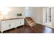 Foyer displaying hardwood floors, cabinet and uniquely designed brick steps leading to an additional room at 3 W Yale St, Orlando, FL 32804