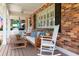Relaxing front porch with comfortable seating, a porch swing, and views of the beautifully landscaped yard at 3 W Yale St, Orlando, FL 32804