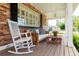 Relaxing front porch with comfortable seating, a porch swing, and views of the beautifully landscaped yard at 3 W Yale St, Orlando, FL 32804