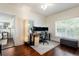 Bright home office with large windows, a gray area rug, and modern computer setup at 3 W Yale St, Orlando, FL 32804