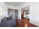 Living room featuring bookshelves and a comfortable neutral colored sofa with red tile floors at 3 W Yale St, Orlando, FL 32804