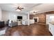 Open concept living area with fireplace, hardwood floors and large television for entertaining at 3 W Yale St, Orlando, FL 32804