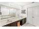 Spacious bathroom featuring a double vanity, large mirror, and separate tub and shower at 3055 Ashland N Ln, Kissimmee, FL 34741