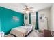 bedroom showcasing an accent wall, ceiling fan, and decor at 3055 Ashland N Ln, Kissimmee, FL 34741
