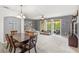 Inviting living area featuring a comfortable sectional sofa, a ceiling fan, and sliding glass doors at 3055 Ashland N Ln, Kissimmee, FL 34741