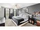 Comfortable main bedroom featuring a ceiling fan, ample natural light, and carpet flooring at 3055 Ashland N Ln, Kissimmee, FL 34741