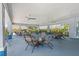 Covered community patio with ample seating, ceiling fans, and an open-air design at 3055 Ashland N Ln, Kissimmee, FL 34741