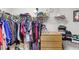 Walk-in closet featuring ample storage space and organized clothing racks and shelves at 3055 Ashland N Ln, Kissimmee, FL 34741