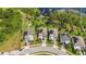 Overhead view of four homes with solar panels and waterside access at 3404 Shallow Cove Ln, Clermont, FL 34711