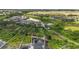 Aerial view of a property with multiple docks at 3404 Shallow Cove Ln, Clermont, FL 34711