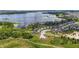 Scenic aerial shot showcasing lakeside homes with private docks and verdant green landscape, a peaceful waterfront community at 3404 Shallow Cove Ln, Clermont, FL 34711