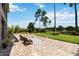 Relaxing brick backyard patio space with beautiful views of nature and the lake at 3404 Shallow Cove Ln, Clermont, FL 34711