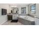 Bright bathroom featuring a large soaking tub, dual vanities, and tiled floors at 3404 Shallow Cove Ln, Clermont, FL 34711