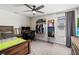 Bedroom featuring a ceiling fan, desk, and clothing rack at 3404 Shallow Cove Ln, Clermont, FL 34711