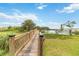 Picturesque wooden bridge leading to a dock on the water at 3404 Shallow Cove Ln, Clermont, FL 34711