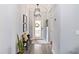 Inviting entryway featuring wood-look flooring, a decorative light fixture, and a welcoming atmosphere at 3404 Shallow Cove Ln, Clermont, FL 34711